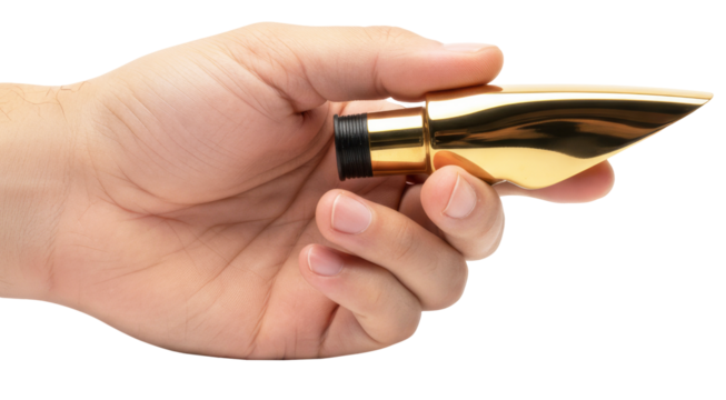 a hand holds a shiny, golden brass saxophone mouthpiece on a white background