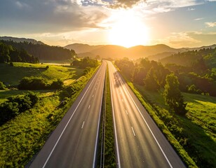 Fototapeta premium Aerial highway view at sunset, with golden sunlight casting long shadows across the road and illuminating the distant mountains