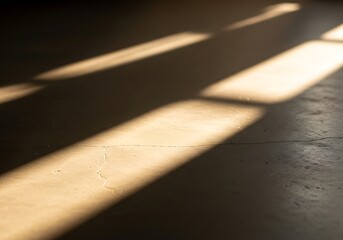 Dramatic Sunlight Stripes Across a Concrete Floor Surface Indoors