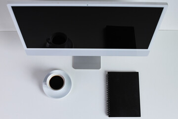 Obraz premium Modern Minimalist Workspace With Computer, Fresh Coffee, And Notebook For Productive Work