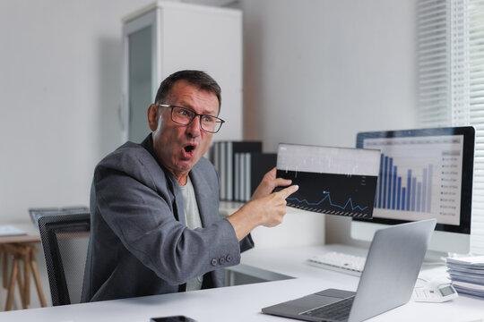 Businessman reacting to unexpected financial data loss