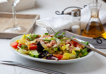 Salad with assorted seasonal vegetables and canned tuna.