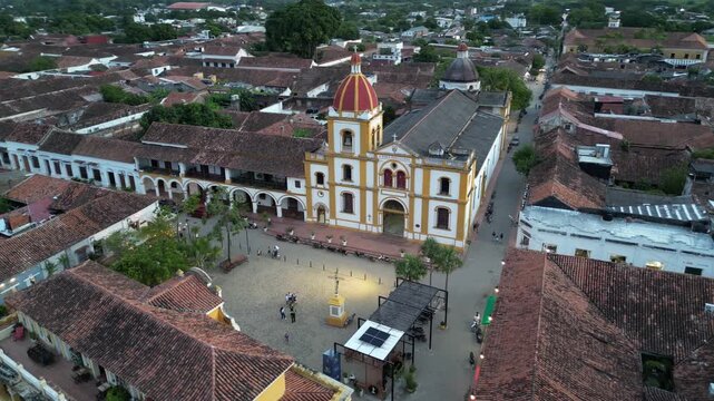 Aerial view of Santa Cruz de Mompox (Momp&oacute;s) on the banks of the Magdalena River in the Bol&iacute;var Department in Colombia, showing Plaza Real De La Concepci&oacute;n and Inmaculada Concepci&oacute;n church at sunset