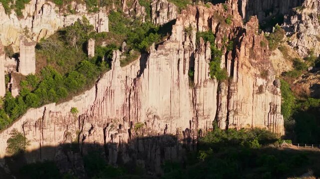 dolly out drone shot flying over the impressive eroded rock formations of los estoraques national park