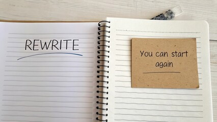Notebook with motivational phrases for fresh starts and creativity