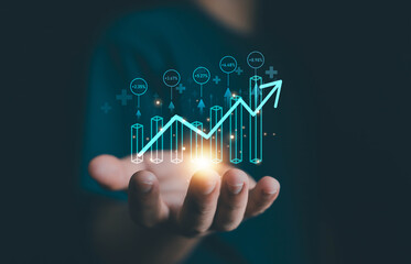 Hand holding glowing digital graph with upward arrow, representing business growth, financial success, investment performance, data analytics, and technology innovation for smart business strategy.
