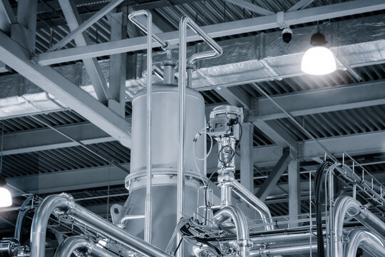 Food production machine with stainless steel pipes, cooling radiator as separator and tanks, valves and measuring instruments