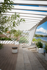 Scenic Waterfront Lounge with Modern Pergola Design