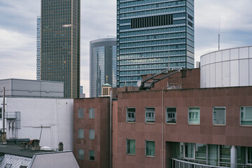 Contemporary corporate skyline and modern architecture in Frankfurt, Germany, showing office buildings, geometric facades and clean lines under neutral daylight across the financial district