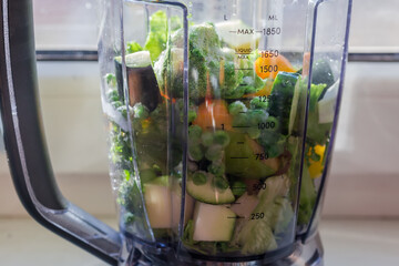 Ingredients for making smoothie in blender bowl closeup, selective focus
