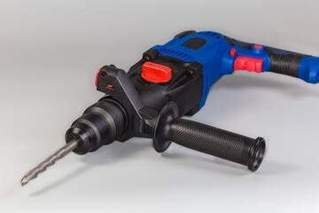 Electric rotary hammer with inserted drill bit, fragment close-up