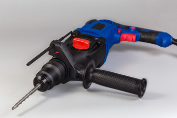 Rotary hammer with depth gauge ruler and inserted drill bit