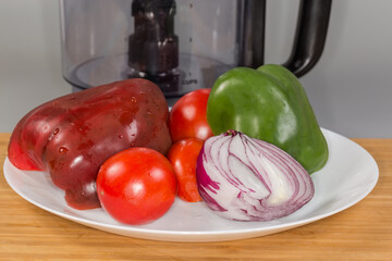 Washed vegetables against processing work bowl of food processor