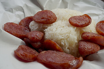 Fried Chinese sausage sliced with sticky rice Thai street food meal