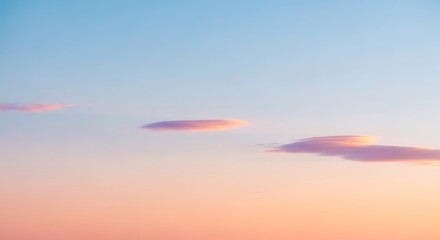 Serene gradient sky panorama featuring unique lenticular cloud formations