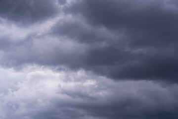the sky is covered with gray rain clouds, selective focus