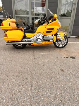 Vsevolozhsk,Leningrad region,Russia-October 3,2025:A parked yellow honda gl 1800 gold wing motorcycle.