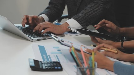 Financial analysts analyze business financial reports on a digital tablet planning investment project during a discussion at a meeting of corporate showing the results of their successful teamwork. - Powered by Adobe