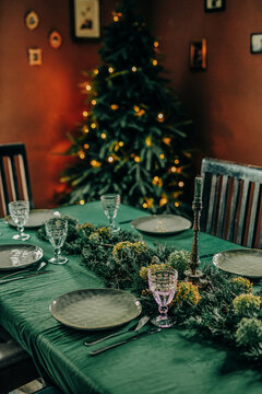 Christmas dinner table with festive decorations and vintage style interior
