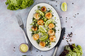 Scallops with a basil sauce.