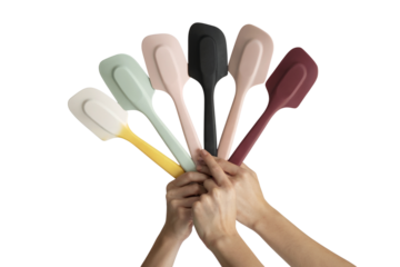 collection of various colored spatulas being held up by hands. Isolated on transparent background, png