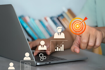 Reaching goals concept person using laptop with business target success strategy idea