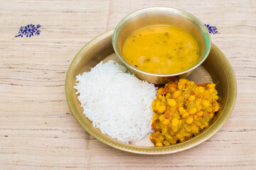 Chhath Puja Nahay Khaye food  steamed rice (chawal), dal, and lauki ki sabji in a copper plate served as a sacred dish.