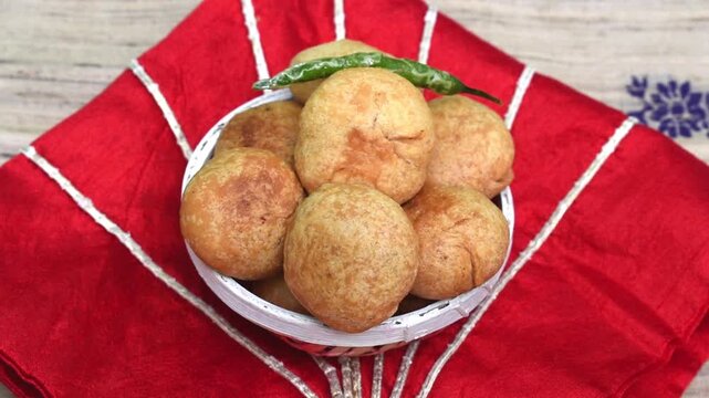 golden, crispy Indian snacks kachodi are stuffed with a spiced filling and make a perfect tea-time treat, festive food, or party appetizer