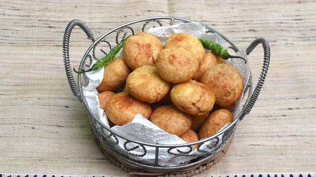 Mini Kachori Served in rustic basket &ndash; Indian Snack or Tea-Time Food