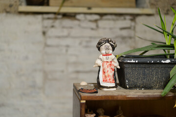 Traditional Ukrainian toy mascot motanka. Ceramic decor. Place for text