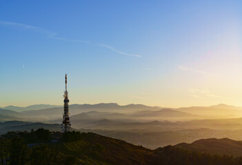 Communications tower. Antennas at sunset on Mount Jaizkibel, Basque Country
