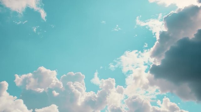 Video A plane flying through a clear blue sky with white clouds