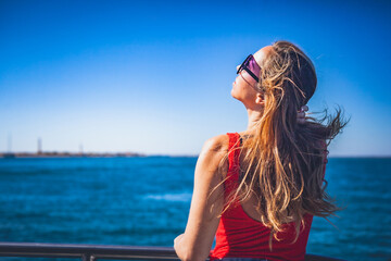 woman enjoying boat trip on ria formosa towards farol island
