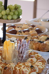 Snack buffet with cheese, dried sausages, bread with dip and grapes, rustic appetizer and finger food arrangement