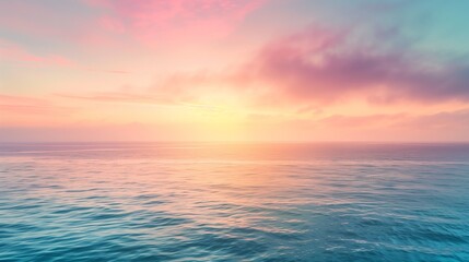 Obraz premium Soft pastel sunrise over ocean with light morning mist, peaceful tranquil background scene.