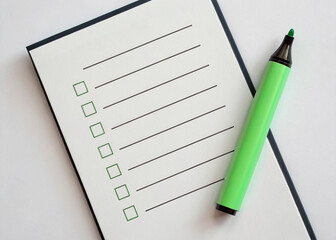 check list with green pencil