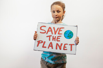 Child holding Save the Planet protest sign.
