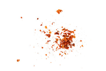 Flying crushed red pepper flakes scattered in air creating spicy seasoning texture and dynamic food explosion concept for cooking, hot flavor design, and culinary background
