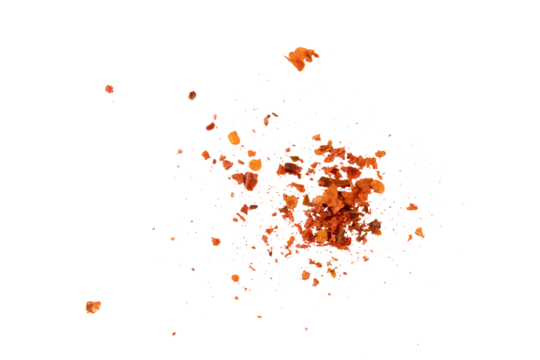 Flying crushed red pepper flakes scattered in air creating spicy seasoning texture and dynamic food explosion concept for cooking, hot flavor design, and culinary background