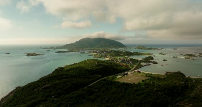 Aerial riser reveals scenic Sommaroya summer island in Kvaloya, Norway