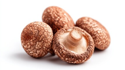 Fresh shiitake mushrooms with textured caps, arranged together, showcasing their rich brown color and unique patterns.