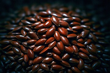 A close-up shot reveals a mound of shiny brown flax seeds with a dark blurred background emphasizing their texture