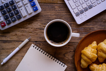 calculator and pen on desk