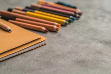 Close-up of back-to-school stationery with notebooks, pencils, and markers.