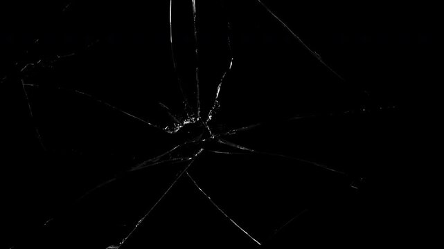 Realistic Breaking glass fragments animated to create a realistic cracking or shattering effect on black. High-detail shatter simulation ideal for cinematic intros, crime scenes, or tension visuals.