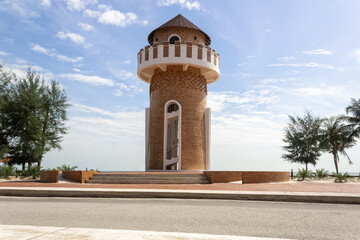 Fototapeta premium Peaceful Park by the Sea with Concrete Bench and watch tower View in Pantai Kempadang, Kuantan Pahang, Malaysia