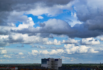 Cloudy sky over city apartment buildings