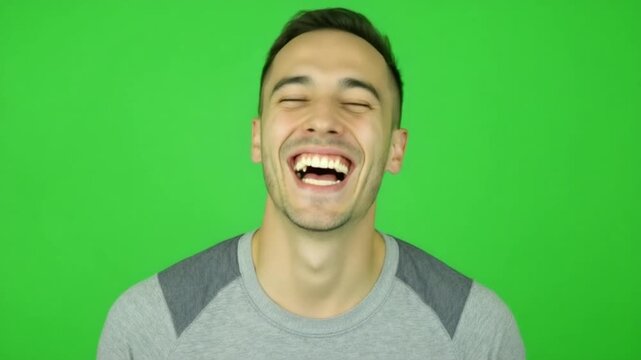 Man Laughing Hysterically on Green Screen - A Hilarious Moment.