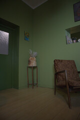 Vintage Living Room with Green Walls and Armchair