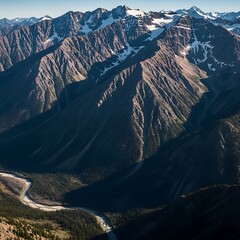 Majestic Mountain Range Landscape with River Valley and Snow-Capped Peaks.